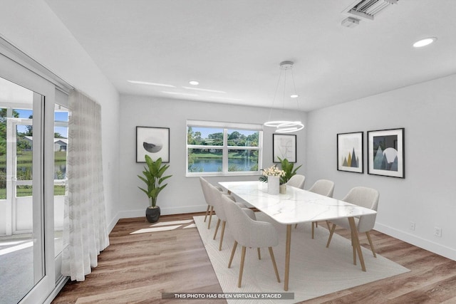 4110 NW 10th St, Delray Beach, FL 33445 - dining area featuring light wood finished floors, recessed lighting, and a water view