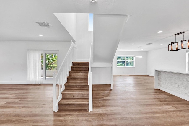 4110 NW 10th St, Delray Beach, FL 33445 - staircase with healthy amount of natural light, recessed lighting, and wood finished floors