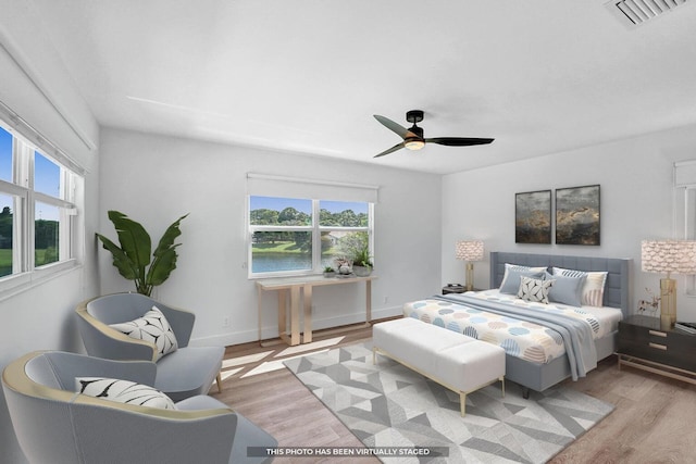 4110 NW 10th St, Delray Beach, FL 33445 - bedroom featuring multiple windows, light wood-type flooring, and ceiling fan