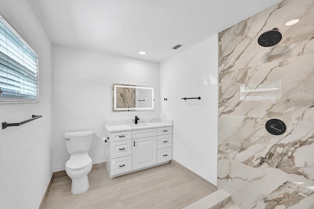 4110 NW 10th St, Delray Beach, FL 33445 - full bathroom with a marble finish shower, vanity, recessed lighting, and wood finished floors