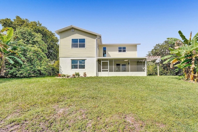 4110 NW 10th St, Delray Beach, FL 33445 - rear view of property with a sunroom and a yard