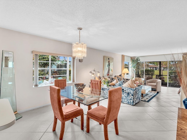 5869 Sugar Palm A Ct Unit A, Delray Beach, FL 33484 - dining room with plenty of natural light, a chandelier, a textured ceiling, and light tile patterned flooring