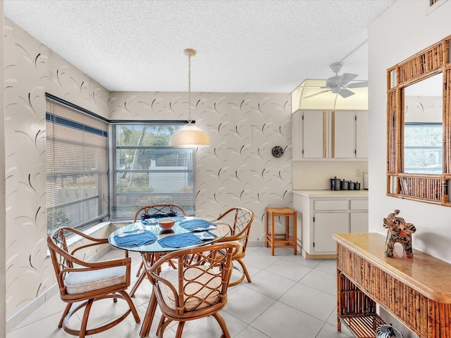 5869 Sugar Palm A Ct Unit A, Delray Beach, FL 33484 - dining area featuring wallpapered walls, ceiling fan, and a textured ceiling