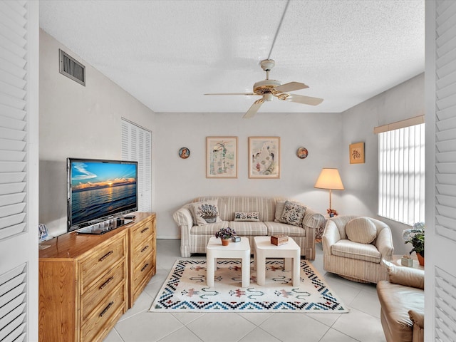 5869 Sugar Palm A Ct Unit A, Delray Beach, FL 33484 - living area with ceiling fan, light tile patterned floors, and a textured ceiling