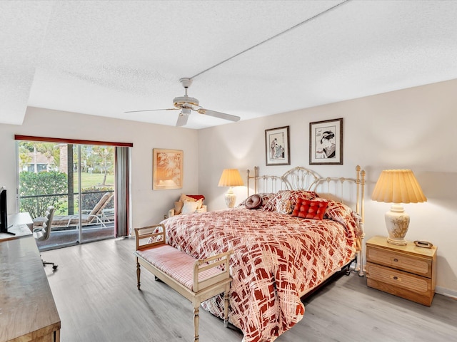 5869 Sugar Palm A Ct Unit A, Delray Beach, FL 33484 - bedroom with access to outside, wood finished floors, a textured ceiling, and ceiling fan
