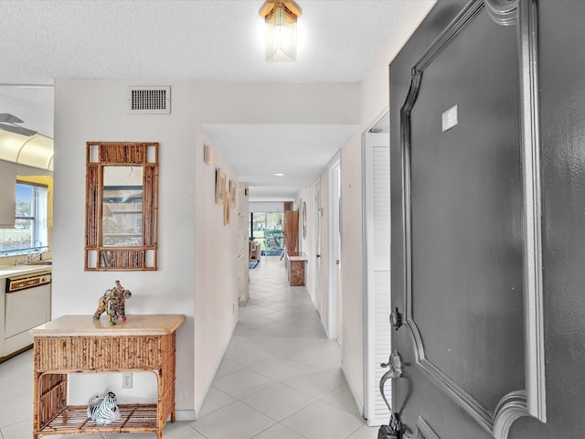 5869 Sugar Palm A Ct Unit A, Delray Beach, FL 33484 - hall with light tile patterned flooring and a textured ceiling