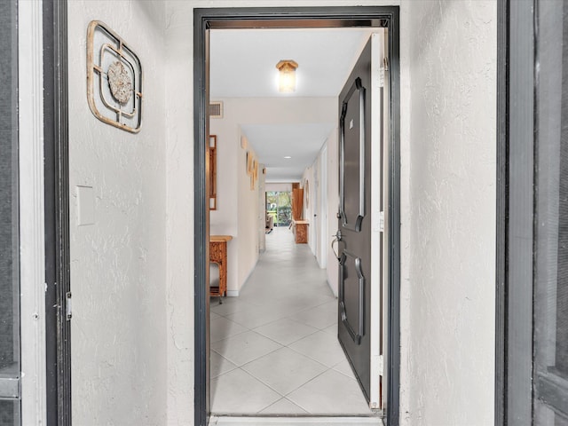 5869 Sugar Palm A Ct Unit A, Delray Beach, FL 33484 - hallway featuring a textured wall and light tile patterned flooring