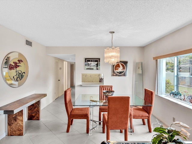 5869 Sugar Palm A Ct Unit A, Delray Beach, FL 33484 - dining space featuring a chandelier and a textured ceiling