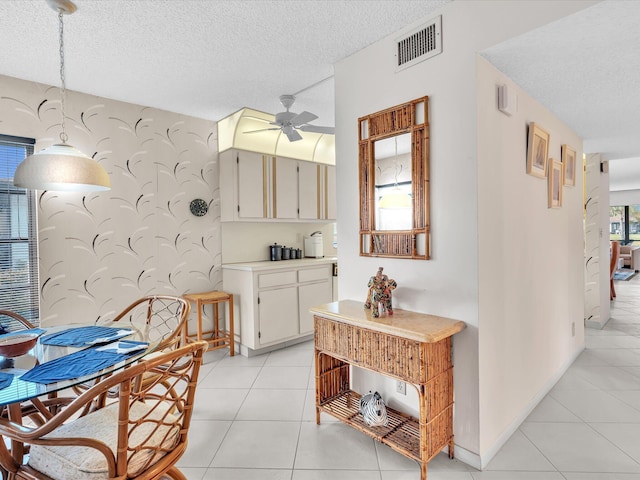 5869 Sugar Palm A Ct Unit A, Delray Beach, FL 33484 - dining space featuring ceiling fan, a textured ceiling, and light tile patterned flooring