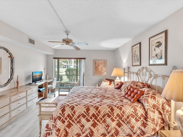 5869 Sugar Palm A Ct Unit A, Delray Beach, FL 33484 - bedroom featuring access to outside, a textured ceiling, light wood-style flooring, ceiling fan, and an office area