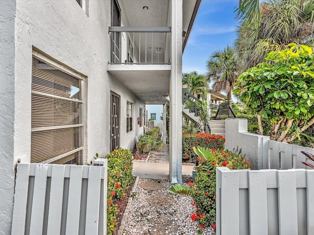 5869 Sugar Palm A Ct Unit A, Delray Beach, FL 33484 - view of home's exterior featuring stucco siding and stairs