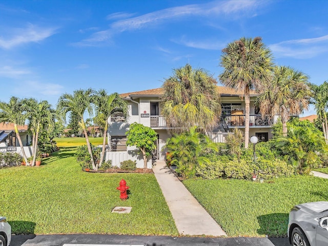 5869 Sugar Palm A Ct Unit A, Delray Beach, FL 33484 - obstructed view of property with stucco siding and a front yard