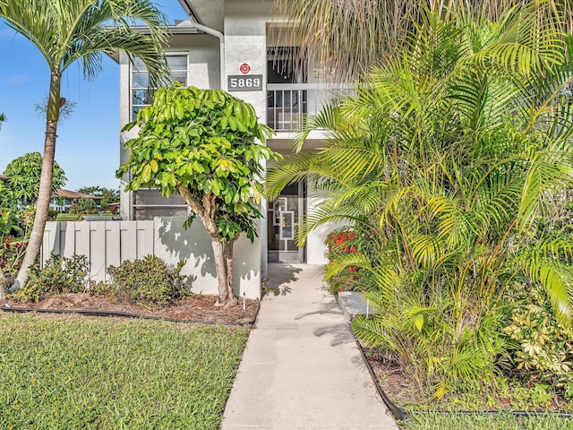 5869 Sugar Palm A Ct Unit A, Delray Beach, FL 33484 - doorway to property featuring stucco siding