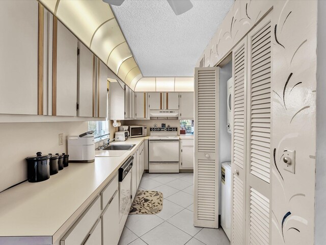 5869 Sugar Palm A Ct Unit A, Delray Beach, FL 33484 - kitchen featuring white appliances, under cabinet range hood, light countertops, light tile patterned flooring, and a textured ceiling