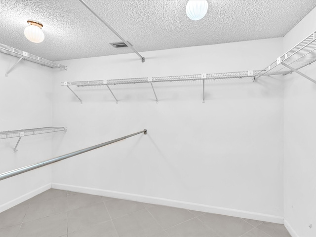 5869 Sugar Palm A Ct Unit A, Delray Beach, FL 33484 - spacious closet featuring light tile patterned floors