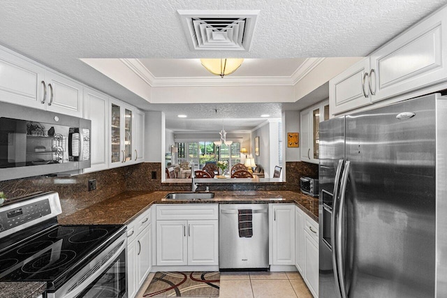 6662 Boca Del Mar Dr Unit 118, Boca Raton, FL 33433 - kitchen featuring stainless steel appliances, crown molding, white cabinetry, glass insert cabinets, and light tile patterned floors