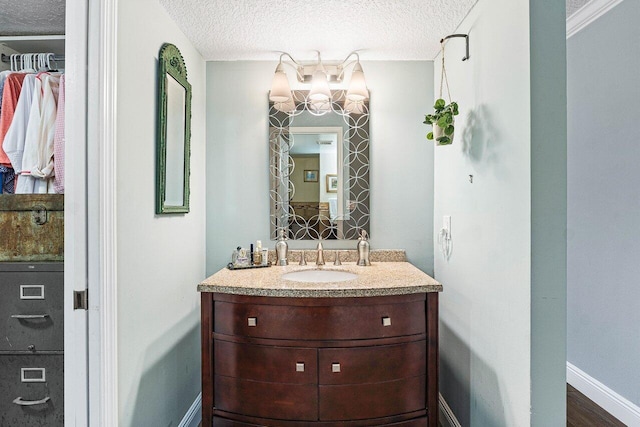 6662 Boca Del Mar Dr Unit 118, Boca Raton, FL 33433 - bathroom featuring a textured ceiling and vanity