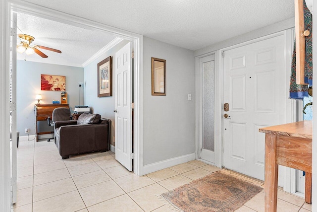 6662 Boca Del Mar Dr Unit 118, Boca Raton, FL 33433 - entryway with a textured ceiling, light tile patterned flooring, a ceiling fan, and crown molding