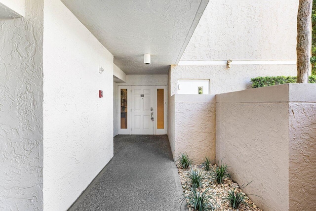 6662 Boca Del Mar Dr Unit 118, Boca Raton, FL 33433 - doorway to property featuring stucco siding