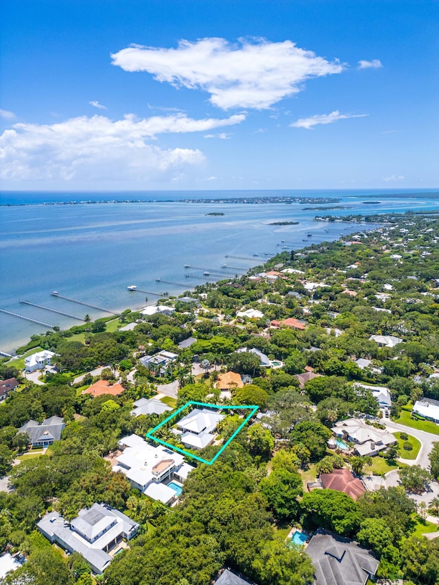 104 Hillcrest Dr, Sewalls Point, FL 34996 - aerial perspective of suburban area with property boundaries highlighted and a nearby body of water