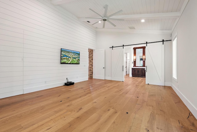 104 Hillcrest Dr, Sewalls Point, FL 34996 - unfurnished living room with a barn door, light wood finished floors, beam ceiling, ceiling fan, and high vaulted ceiling