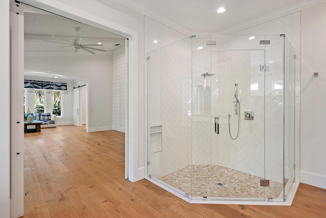 104 Hillcrest Dr, Sewalls Point, FL 34996 - bathroom with wood finished floors, a stall shower, recessed lighting, and a ceiling fan