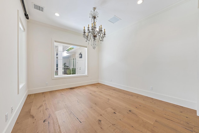 104 Hillcrest Dr, Sewalls Point, FL 34996 - empty room with a chandelier, crown molding, recessed lighting, and wood-type flooring