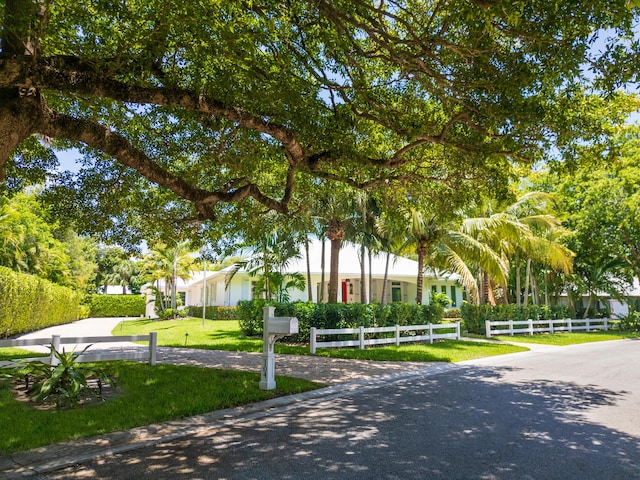 104 Hillcrest Dr, Sewalls Point, FL 34996 - view of front of property with a fenced front yard