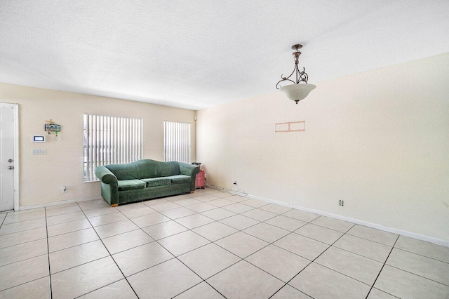 841 Summit Lake Dr, West Palm Beach, FL 33406 - living area with light tile patterned floors and a textured ceiling
