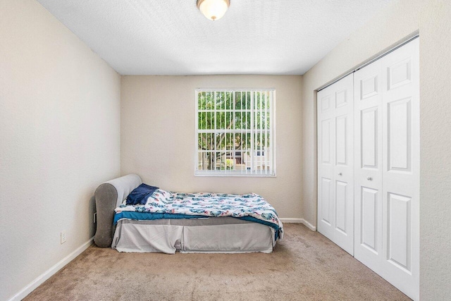841 Summit Lake Dr, West Palm Beach, FL 33406 - carpeted bedroom with a closet and a textured ceiling