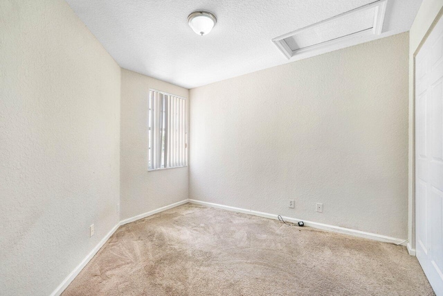 841 Summit Lake Dr, West Palm Beach, FL 33406 - empty room featuring attic access, carpet flooring, a textured wall, and a textured ceiling
