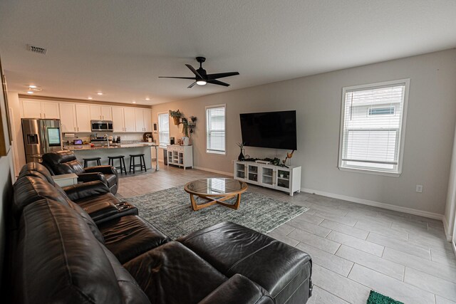 10782 SW Vasari Way, Port Saint Lucie, FL 34987 - living room featuring healthy amount of natural light, ceiling fan, light tile patterned floors, and recessed lighting