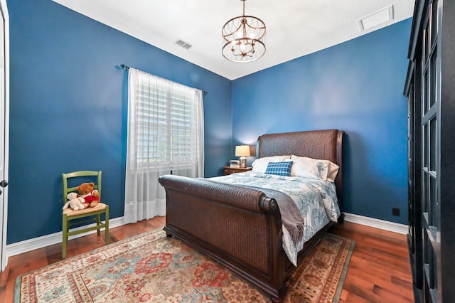 908 SW Squire Johns Ln, Palm City, FL 34990 - bedroom featuring a chandelier and wood finished floors