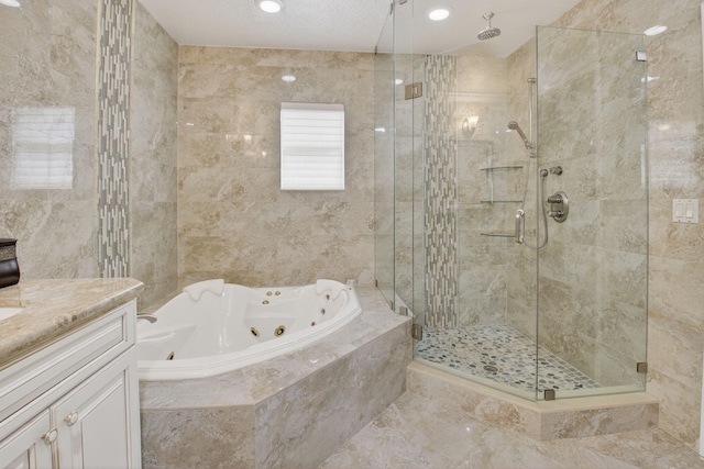 2 Fairway Dr, Boynton Beach, FL 33436 - bathroom featuring a shower stall, a jetted tub, and vanity