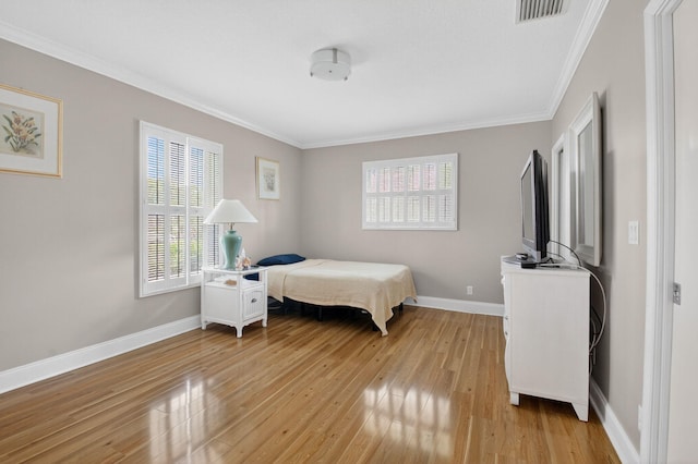 2 Fairway Dr, Boynton Beach, FL 33436 - bedroom featuring multiple windows, light wood-style floors, and crown molding
