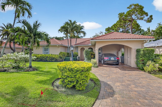 2 Fairway Dr, Boynton Beach, FL 33436 - mediterranean / spanish-style house featuring stucco siding, a front lawn, decorative driveway, and a tile roof