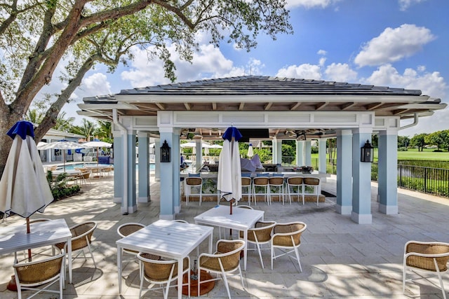 2 Fairway Dr, Boynton Beach, FL 33436 - view of patio featuring a gazebo, an outdoor pool, and a water view