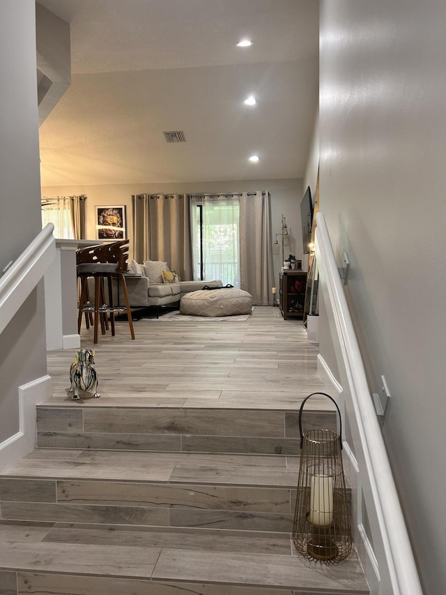 5710 Coach House F Cir Unit F, Boca Raton, FL 33486 - living room featuring wood finished floors, recessed lighting, and stairs