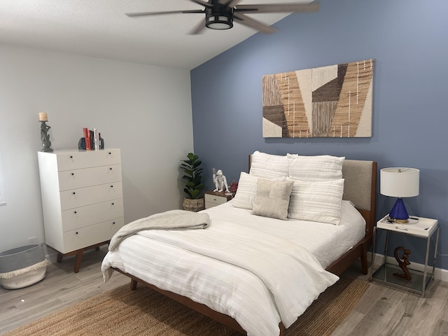 5710 Coach House F Cir Unit F, Boca Raton, FL 33486 - bedroom featuring wood finished floors, vaulted ceiling, and ceiling fan