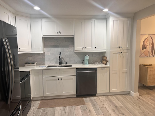 5710 Coach House F Cir Unit F, Boca Raton, FL 33486 - kitchen featuring freestanding refrigerator, stainless steel dishwasher, stove, light countertops, and white cabinets