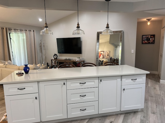 5710 Coach House F Cir Unit F, Boca Raton, FL 33486 - kitchen with open floor plan, light wood-style floors, light countertops, and white cabinets