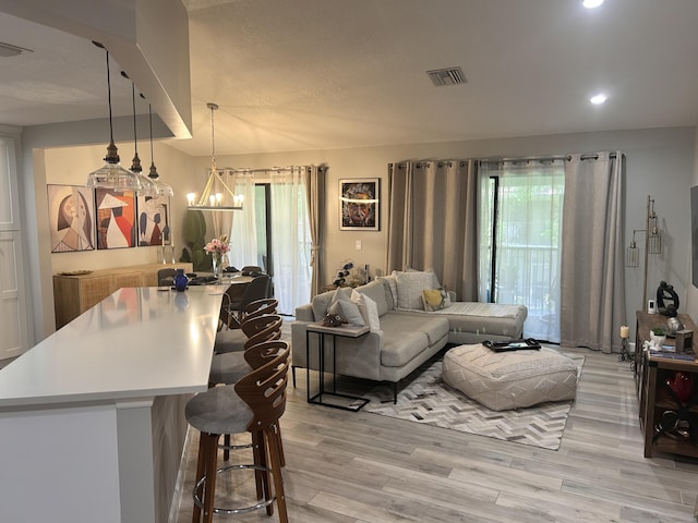 5710 Coach House F Cir Unit F, Boca Raton, FL 33486 - living room featuring light wood finished floors, a chandelier, and recessed lighting