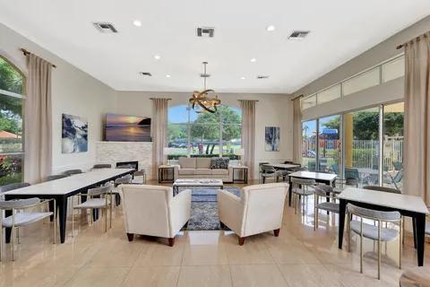 5129 Elpine Way, Riviera Beach, FL 33418 - living room featuring light tile patterned floors, a chandelier, and recessed lighting