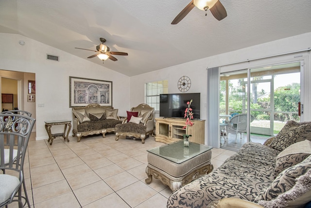 5064 El Claro Cir, West Palm Beach, FL 33415 - living area with ceiling fan, vaulted ceiling, and light tile patterned flooring