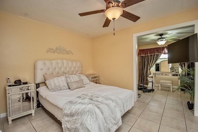 5064 El Claro Cir, West Palm Beach, FL 33415 - bedroom featuring light tile patterned floors, a textured ceiling, and a ceiling fan