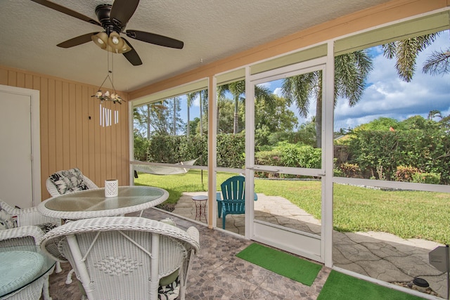5064 El Claro Cir, West Palm Beach, FL 33415 - sunroom / solarium with a ceiling fan and outdoor dining space