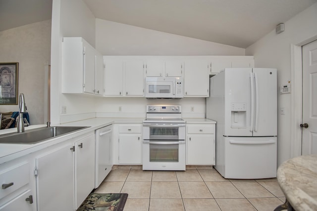 5064 El Claro Cir, West Palm Beach, FL 33415 - kitchen with white appliances, vaulted ceiling, white cabinets, and light countertops