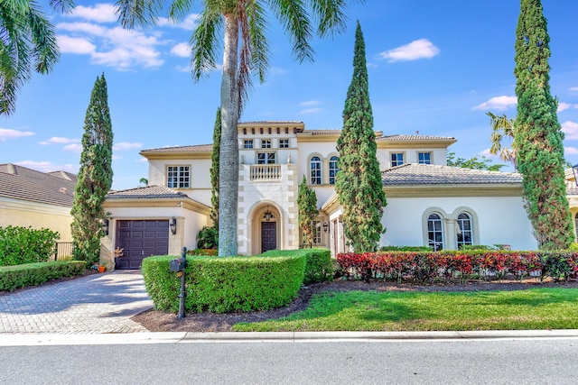 6404 Dorsay Ct, Delray Beach, FL 33484 - mediterranean / spanish house with stucco siding, an attached garage, driveway, and a tile roof