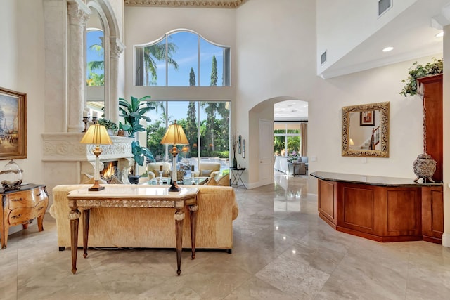 6404 Dorsay Ct, Delray Beach, FL 33484 - living room with arched walkways, light marble finish floors, and a high ceiling