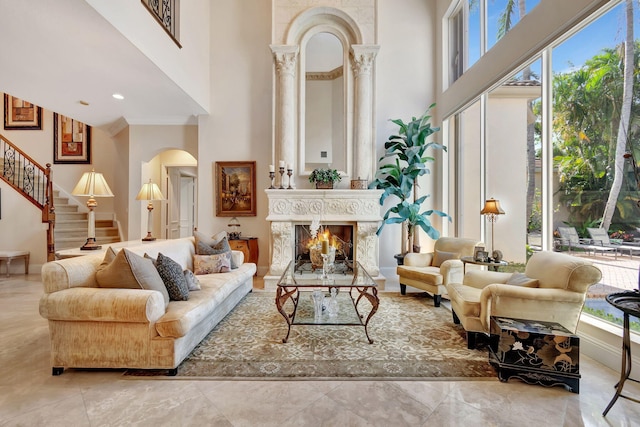 6404 Dorsay Ct, Delray Beach, FL 33484 - living area featuring a towering ceiling, arched walkways, stairway, a premium fireplace, and marble finish floors